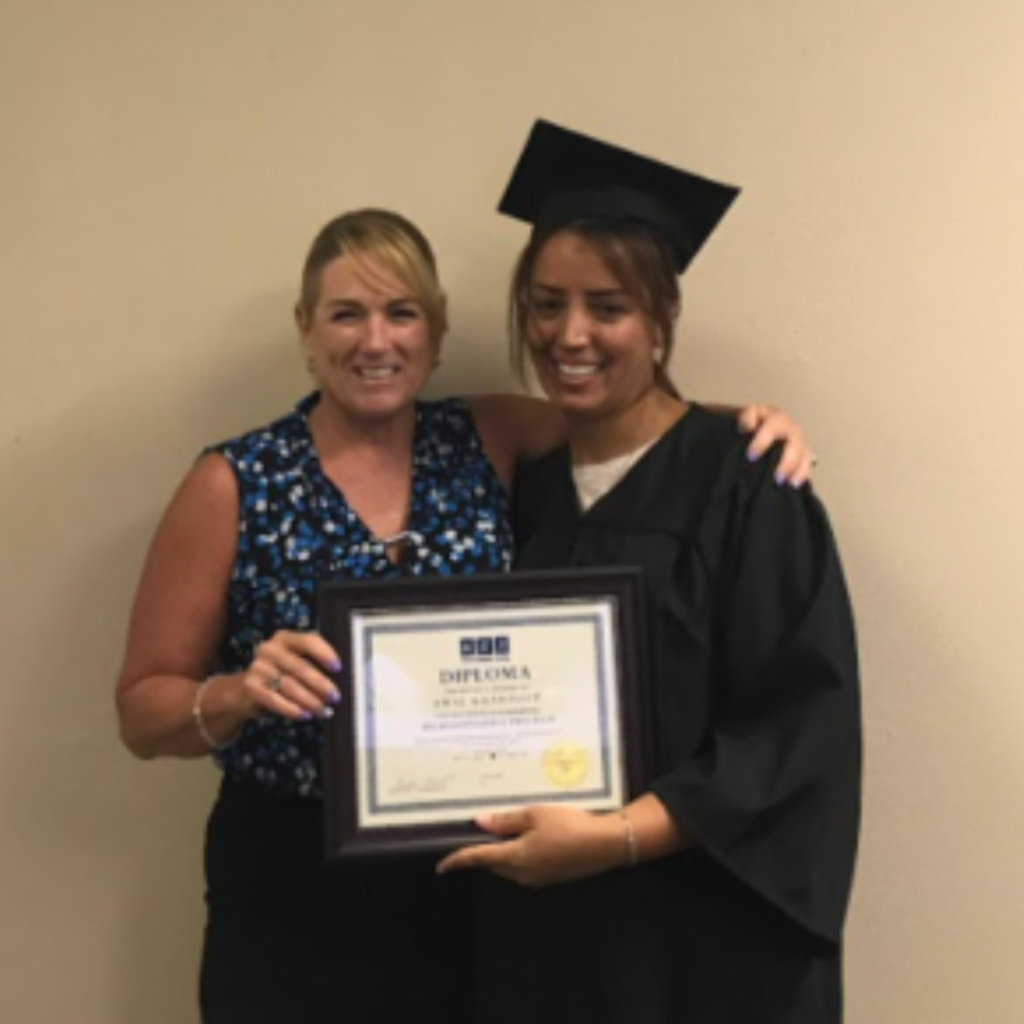 A graduate receive her Certificate of Completion for Computer Training in Tampa headed Kristin Pelletier by ACT